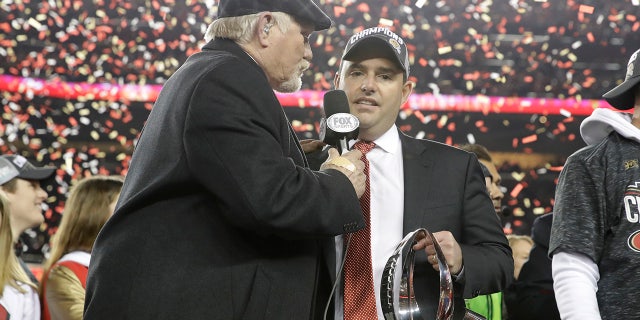 San Francisco 49ers owner Jed York, center, is interviewed by Terry Bradshaw after the NFL NFC Championship football game against the Green Bay Packers Sunday, Jan. 19, 2020, in Santa Clara, Calif. The 49ers won 37-20 to advance to Super Bowl 54 against the Kansas City Chiefs. (AP Photo/Marcio Jose Sanchez)