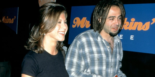 Jennifer Aniston and American musician Adam Duritz attend the "Mr. Jenkins Soiree" at the Ace Gallery Los Angeles on September 29, 1995 in Los Angeles, California.