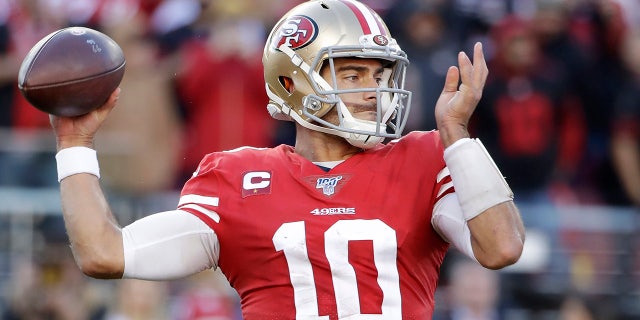 San Francisco 49ers quarterback Jimmy Garoppolo (10) passes against the Minnesota Vikings during the first half of an NFL divisional playoff football game, Saturday, Jan. 11, 2020, in Santa Clara, Calif. (AP Photo/Marcio Jose Sanchez)