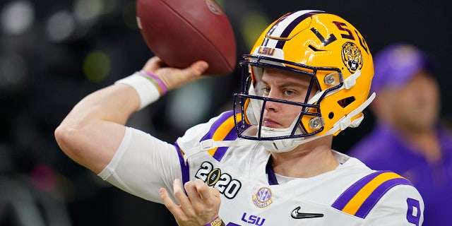 LSU quarterback Joe Burrow warms up before a NCAA College Football Playoff national championship game against Clemson Monday, Jan. 13, 2020, in New Orleans. (AP Photo/David J. Phillip)