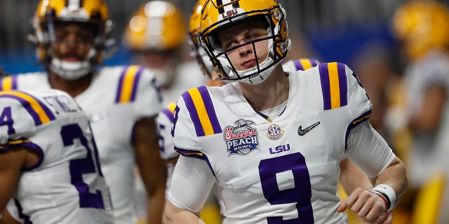 LSU quarterback Joe Burrow (9) warms up before the first half of the Peach Bowl NCAA semifinal college football playoff game between LSU and Oklahoma, Saturday, Dec. 28, 2019, in Atlanta. (AP Photo/John Bazemore)