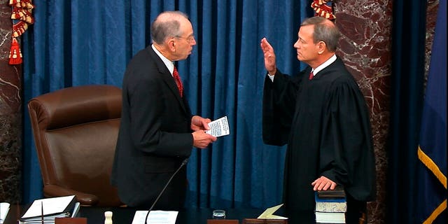 President Pro Tempore of the Senate Sen. Chuck Grassley, R-Iowa., swears in Supreme Court Chief Justice John Roberts as the presiding officer for the impeachment trial of President Donald Trump in the Senate at the U.S. Capitol in Washington, Thursday, Jan. 16, 2020. (Senate Television via AP)