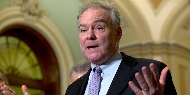Sen. Tim Kaine D-Va., speaks during a news conference outside of the Senate chamber, on Capitol Hill in Washington, Tuesday, Jan. 14, 2020. (AP Photo/Jose Luis Magana)