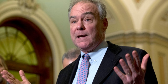 Sen. Tim Kaine D-Va., speaks during a news conference outside the Senate chamber on Capitol Hill in Washington, Jan. 14, 2020. (AP Photo/Jose Luis Magana)