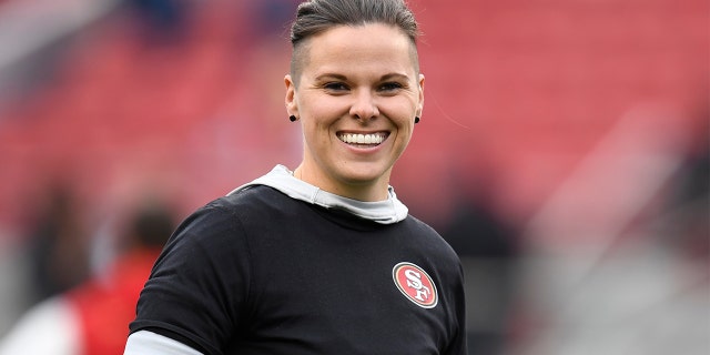 San Francisco 49ers offensive assistant Katie Sowers stands on the field before their NFC Championship game against the Green Bay Packers at Levi's Stadium in Santa Clara, Calif. (Jose Carlos Fajardo/Bay Area News Group)