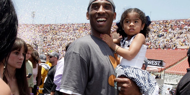 Los Angeles Lakers' Kobe Bryant with his daughter Gianna in 2009. Both died in the helicopter crash Sunday. (AP Photo/Jae C. Hong, File)