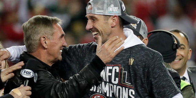 Kyle Shanahan celebrates with his father, Mike, after winning the NFC Championship. (AP Photo/Matt York)