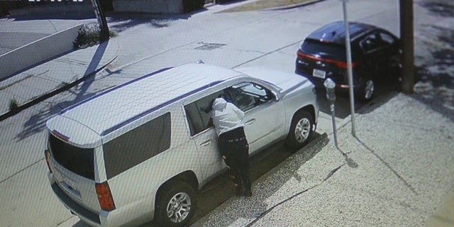 US News A person burglarizes a vehicle in broad daylight and is caught on video at La Jolla and Melrose avenues in Los Angeles.