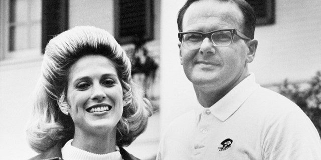 Lamar and Norma Hunt stand in front of their home in Dallas, Texas, June 1, 1970. Hunt is the 37-year-old entrepreneur who presides over a sprawling complex including five professional sports teams that include the champion Kansas City Chiefs. ( AP Photo/Fred Kaufman)