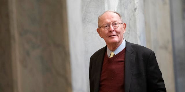 Sen. Lamar Alexander, R-Tenn., arrives on Capitol Hill in Washington, Thursday, Jan. 30, 2020, before the impeachment trial of President Donald Trump on charges of abuse of power and obstruction of Congress. (AP Photo/ Jacquelyn Martin)