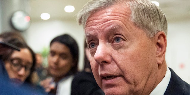 Sen. Lindsey Graham, R-S.C., speaks to reporters as work resumes in the impeachment trial of President Donald Trump on charges of abuse of power and obstruction of Congress on Capitol Hill in Washington, Saturday, Jan. 25, 2020. (AP Photo/Manuel Balce Ceneta)