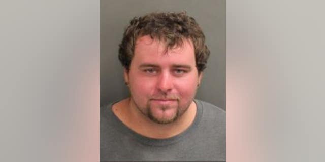 Mason Toney, 28, is charged with murdering his boss Monday. Authorities suspect the slaying may have been prompted by an argument over their opposing political views.