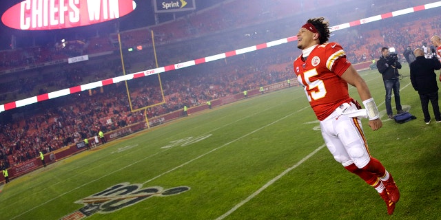 Kansas City Chiefs quarterback Patrick Mahomes celebrates as he comes off the field after an NFL divisional playoff football game against the Houston Texans, Sunday in Kansas City, Mo. (AP Photo/Charlie Riedel)