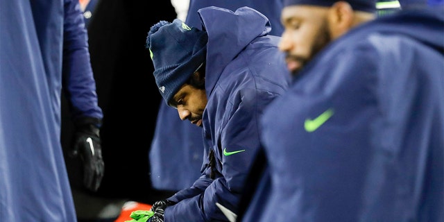 Seattle Seahawks' Marshawn Lynch sits on the bench during the second half an NFL divisional playoff football game against the Green Bay Packers Sunday. (AP Photo/Darron Cummings)