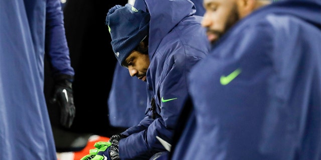 Seattle Seahawks' Marshawn Lynch sits on the bench during the second half an NFL divisional playoff football game against the Green Bay Packers Sunday. (AP Photo/Darron Cummings)