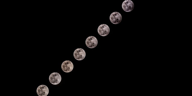 The composite image shows the progression of the Partial Lunar Eclipse in Ankara, Turkey on January 10, 2020. (Photo by Ali Balikci/Anadolu Agency via Getty Images)