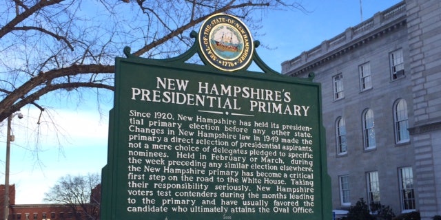 For 100 years, New Hampshire has held the first primary in the race for the White House. A sign marking the primary's history stands outside the Statehouse in Concord, N.H.