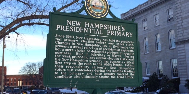 For 100 years, New Hampshire has held the first primary in the race for the White House. A sign marking the primary's history stands outside the Statehouse in Concord, N.H.