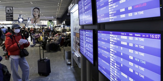 Across the globe — and as seen here on a departures board at the Narita airport in Japan — flights to certain regions of China have been canceled amid reports concerning the novel coronavirus first identified in Wuhan.