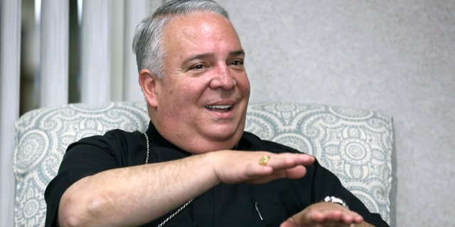 FILE - In this May 30, 2018 file photo, Cleveland Catholic Diocese Bishop Nelson Perez talks during an interview in Cleveland. The Vatican announced Thursday, Jan. 23, 2020, that Perez will become the new leader of the Archdiocese of Philadelphia, making him the first Hispanic archbishop to lead the region’s 1.3 million-member flock. (Lisa DeJong/The Plain Dealer via AP, File)