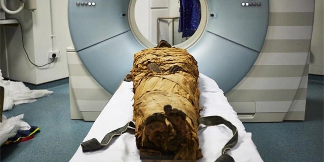 The mummified body of Nesyamun laid on the couch to be CT scanned at Leeds General Infirmary. (Leeds Teaching Hospitals/Leeds Museums and Galleries)