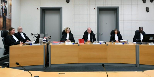 Judges sit in the Assen, Netherlands courtroom before a first procedural hearing of a man accused of keeping his family in seclusion for nine years in an isolated farmhouse.