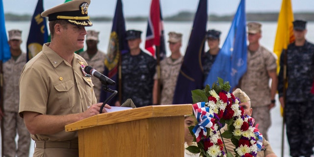 Navy Capt. John R. Nettleton, then-commanding officer of Naval Station Guantanamo Bay, Cuba, spoke during a Battle of Midway commemoration ceremony on June 3, 2014. (Mass Communication Specialist 3rd Class Jacob Goff/U.S. Navy via AP)