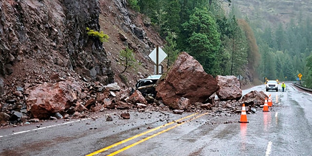 Rockslides triggered by unrelenting rain have closed local roads and highways around Oregon, including a highway near Crater Lake National Park that was closed for hours Tuesday after two boulders the size of a small living room crashed down, narrowly missing the passing car.