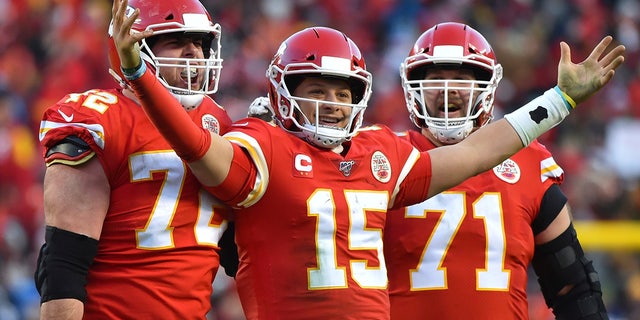 Kansas City Chiefs' Patrick Mahomes (15) celebrates a touchdown pass with Eric Fisher (72) and Mitchell Schwartz (71) during the second half of the NFL AFC Championship football game against the Tennessee Titans Sunday, Jan. 19, 2020, in Kansas City, MO. (AP Photo/Ed Zurga)