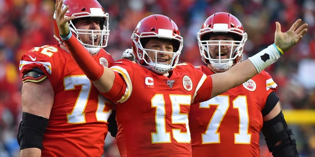 Kansas City Chiefs' Patrick Mahomes (15) celebrates a touchdown pass with Eric Fisher (72) and Mitchell Schwartz (71) during the second half of the NFL AFC Championship football game against the Tennessee Titans Sunday, Jan. 19, 2020, in Kansas City, MO. (AP Photo/Ed Zurga)