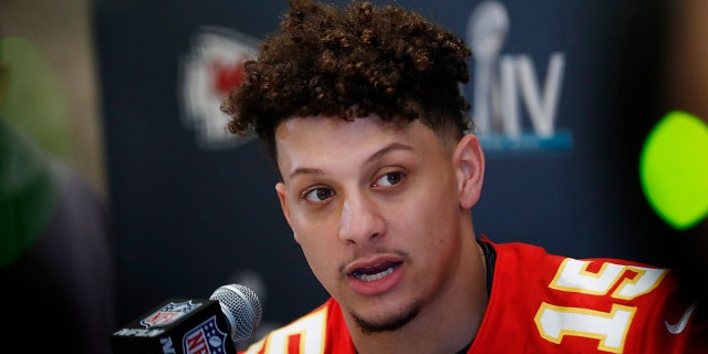Kansas City Chiefs quarterback Patrick Mahomes (15) speaks during a news conference on Tuesday, Jan. 28, 2020, in Aventura, Fla., for NFL Super Bowl 54 football game. (AP Photo/Brynn Anderson)