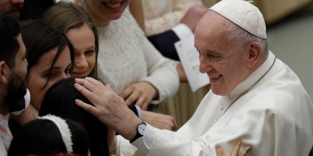 Pope Francis salutes the faithful at the end of his weekly general audience at the Vatican, Wednesday, Jan. 8, 2020. (AP Photo/Gregorio Borgia)