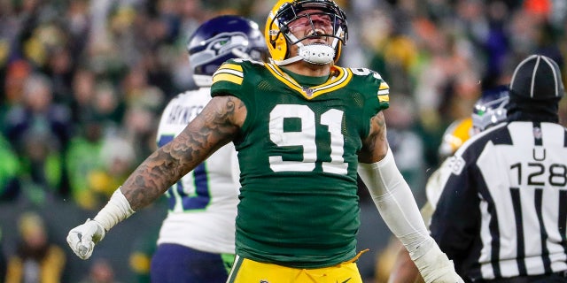 Green Bay Packers' Preston Smith reacts after sacking Seattle Seahawks' Russell Wilson during the second half of an NFL divisional playoff football game Sunday, Jan. 12, 2020, in Green Bay, Wis. (AP Photo/Matt Ludtke)