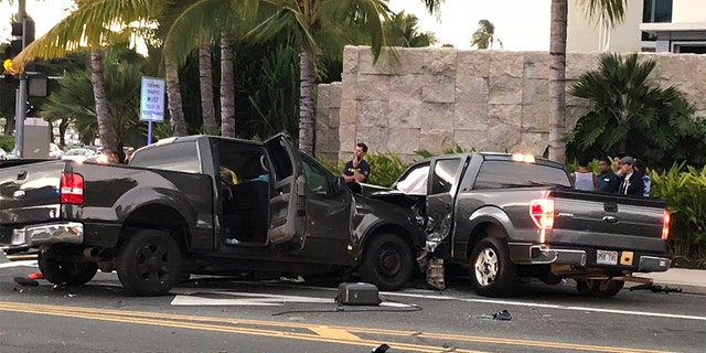 FILE - This Monday, Jan. 28, 2019 file photo shows the scene of a multiple vehicle accident involving two trucks and a bicyclist in Honolulu. Police say a suspected drunk driver slammed into a crowded Honolulu intersection, killing two pedestrians and a bicyclist and injuring five people including himself. (Cindy Ellen Russell/Honolulu Star-Advertiser via AP)