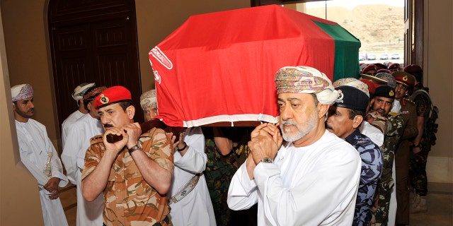 In this photo made available by Oman News Agency, Oman's new sultan Haitham bin Tariq Al Said, right, carries the Sultan Qaboos' coffin at Sultan Qaboos Grand Mosque in Muscat, Oman, Saturday, Jan. 11, 2020. Sultan Qaboos bin Said, the Mideast's longest-ruling monarch who seized power in a 1970 palace coup and pulled his Arabian sultanate into modernity while carefully balancing diplomatic ties between adversaries Iran and the U.S., has died. He was 79. (Oman News Agency via AP)