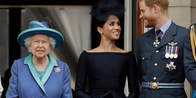 Queen Elizabeth II and Meghan the Duchess of Sussex and Prince Harry. (AP Photo/Matt Dunham, File)