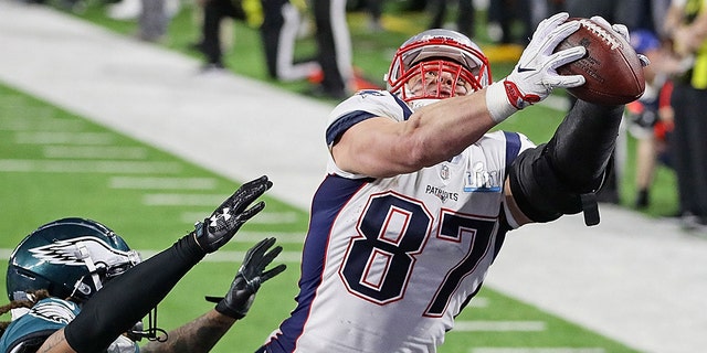 Rob Gronkowski #87 of the New England Patriots makes a 4-yard touchdown reception against Ronald Darby #41 of the Philadelphia Eagles in the fourth quarter of Super Bowl LII at U.S. Bank Stadium on Feb. 4, 2018 in Minneapolis, Minnesota.