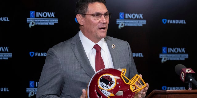 Washington Redskins new head coach Ron Rivera holds up a helmet during a news conference at the team's NFL football training facility, Thursday, Jan. 2, 2020 in Ashburn, Va. (AP Photo/Alex Brandon)