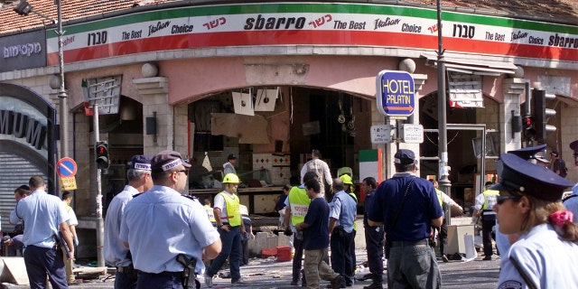 FILE: A gaping hole is left in the shop front of the Sbarro pizzeria after a suicide bombing that killed at least 15 people and wounded 122 others in Jerusalem August 9, 2001. The suicide bomber blew himself up at the restaurant during the busy lunch hour. Seven of the dead were children, including American Malki Roth, who was 15. NB/GB - RP2DRIDUUUAA