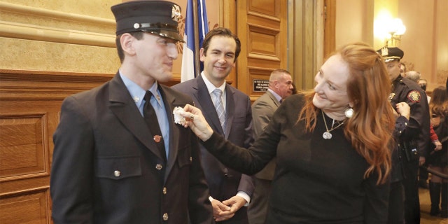 Patti Scialfa congratulates her son Sam Springsteen. (Jersey City Mayor's Office)