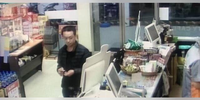 Surveillance from a convenience store showing a suspect in the disappearance and murder of a Chinese-Malaysian woman.