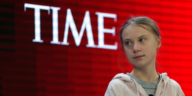 Swedish environmental activist Greta Thunberg takes her seat prior to the opening session of the World Economic Forum in Davos, Switzerland. (AP Photo/Markus Schreiber)