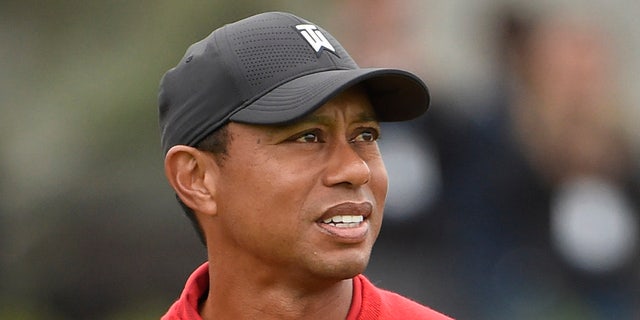 Tiger Woods watches his tee shot on the first hole of the South Course at Torrey Pines Golf Course during the final round of the Farmers Insurance Open golf tournament Sunday Jan. 26, 2020, in San Diego. (Associated Press)