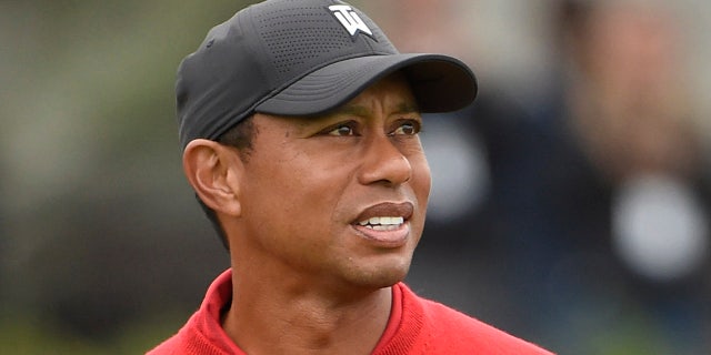 Tiger Woods watches his tee shot on the first hole of the South Course at Torrey Pines Golf Course during the final round of the Farmers Insurance Open golf tournament Sunday Jan. 26, 2020, in San Diego. (Associated Press)