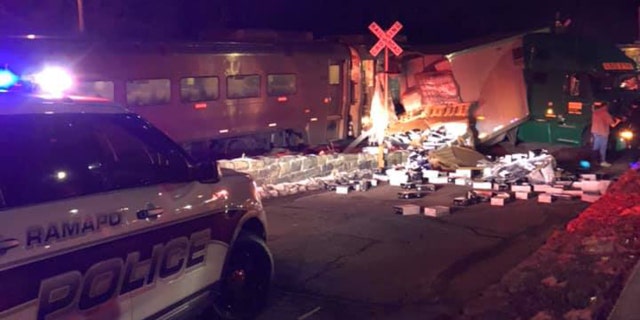 The scene after a Metro-North commuter train struck a tractor-trailer at a railroad crossing.