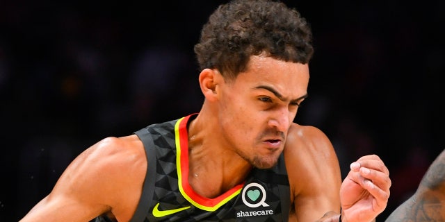 Atlanta Hawks guard Trae Young drives against Indiana Pacers guard Edmond Sumner during the first half of an NBA basketball game Saturday, Jan. 4, 2020, in Atlanta. (AP Photo/John Amis)