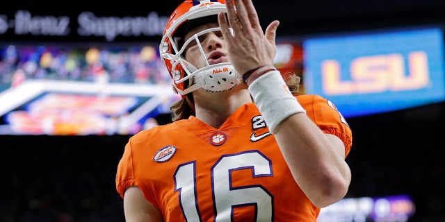 Clemson quarterback Trevor Lawrence celebrates after scoring during the first half of a NCAA College Football Playoff national championship game against LSU Monday, Jan. 13, 2020, in New Orleans. (AP Photo/Gerald Herbert)