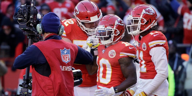 Kansas City Chiefs' Tyreek Hill (10) celebrating his touchdown catch during the first half of the AFC Championship game. (AP Photo/Charlie Riedel)