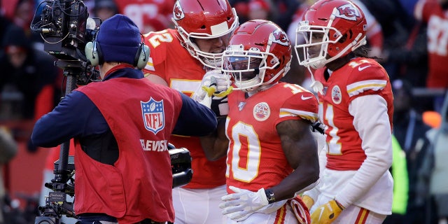 Kansas City Chiefs' Tyreek Hill (10) celebrating his touchdown catch during the first half of the AFC Championship game. (AP Photo/Charlie Riedel)