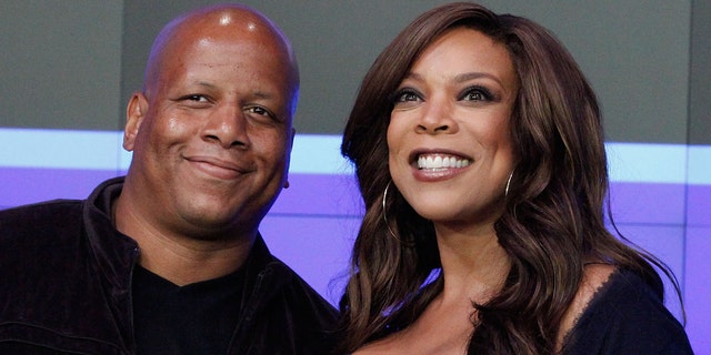 Kevin Hunter and Wendy Williams ring the opening bell at the NASDAQ MarketSite on August 25, 2010, in New York City.